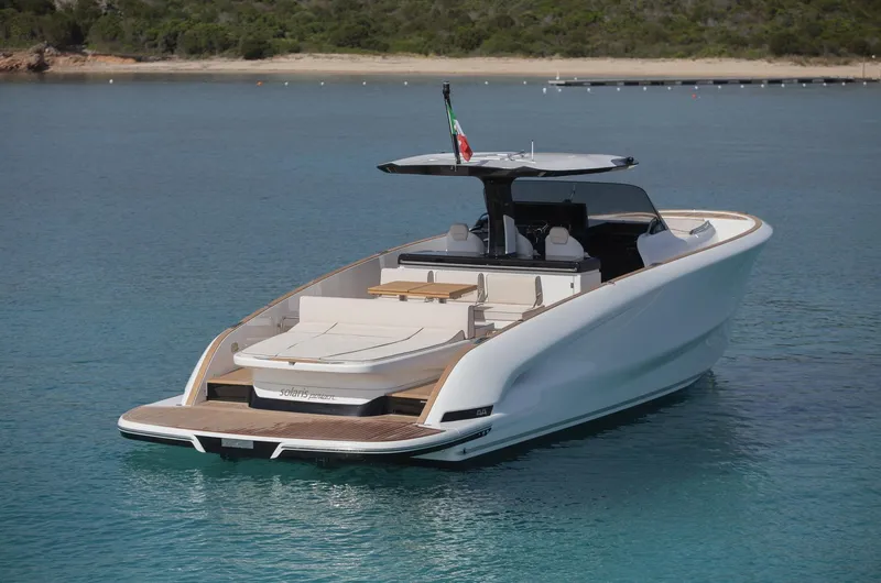 Slide: The Image of 2025 Solaris Power 44 Open luxury yacht on calm blue water. - 4