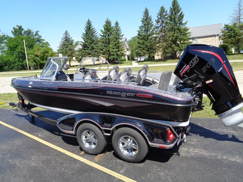 Slide: The Image of 2023 Ranger 1880 MS Angler boat with trailer, parked outdoors. - 1
