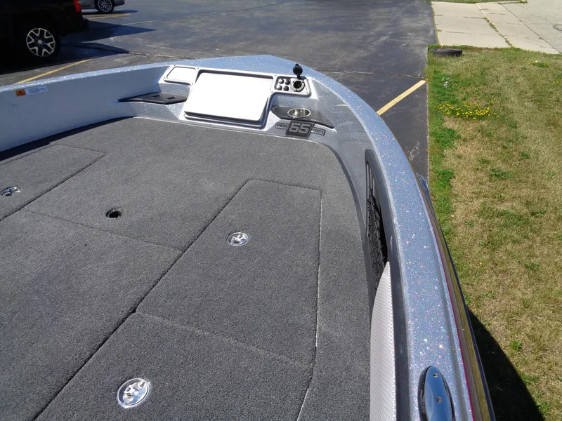 Slide: The Image of 2023 Ranger 1880 MS Angler boat deck with storage compartments and control panel. - 12