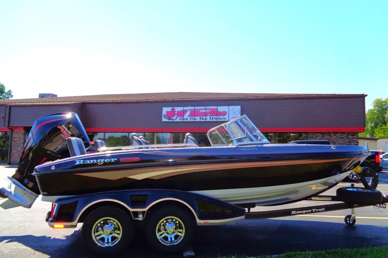 Slide: The Image of 2023 Ranger 1880 MS Angler boat on trailer outside dealership. - 18