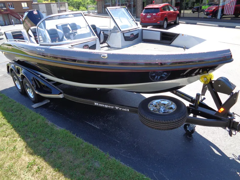Slide: The Image of 2023 Ranger 1880 MS Angler boat on trailer, parked outdoors. - 6