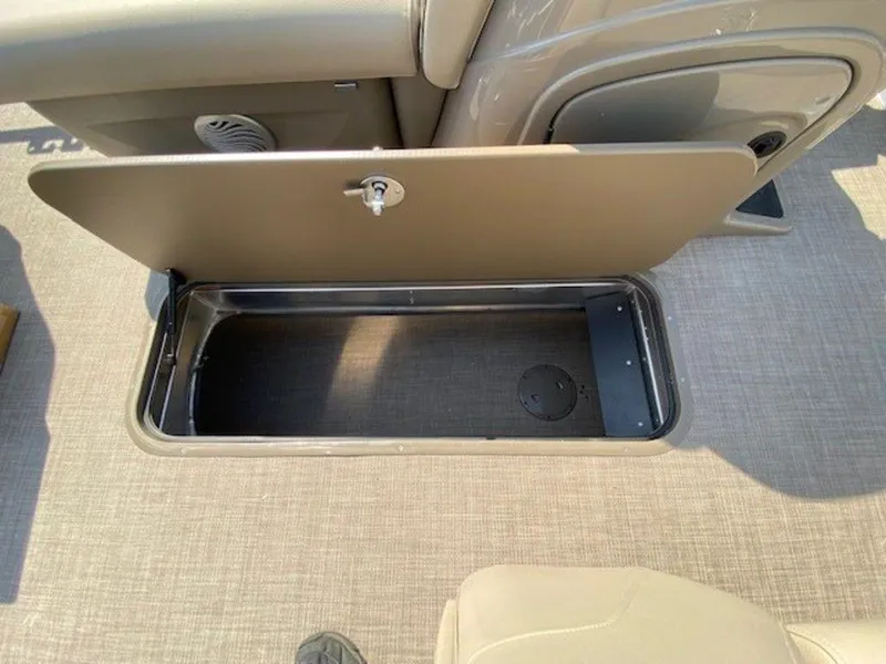 Slide: The Image of 2022 Sun Tracker FB 22 XP3 storage compartment with open lid. - 11