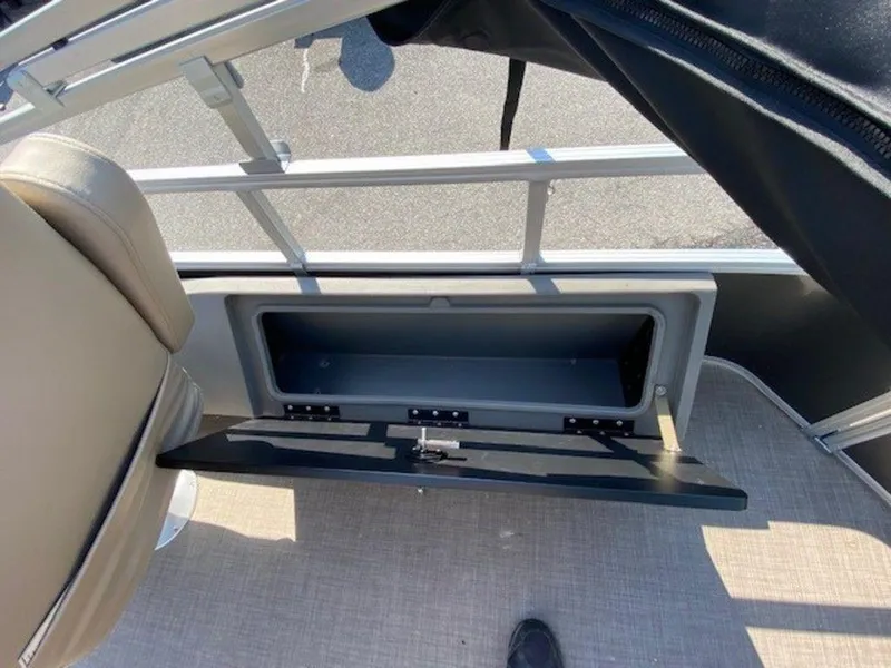 Slide: The Image of Open storage compartment on a 2022 Sun Tracker FB 22 XP3 pontoon boat. - 4