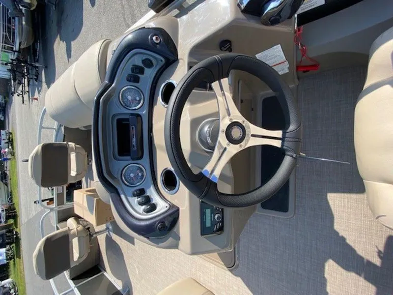 Slide: The Image of 2022 Sun Tracker FB 22 XP3 boat dashboard and steering wheel. - 6
