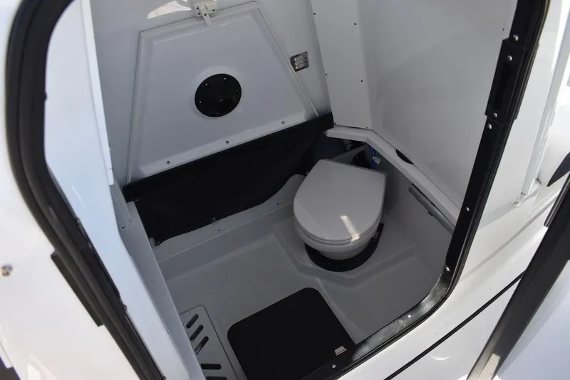 Slide: The Image of 2023 Blackfin 272CC boat interior bathroom with toilet. - 12
