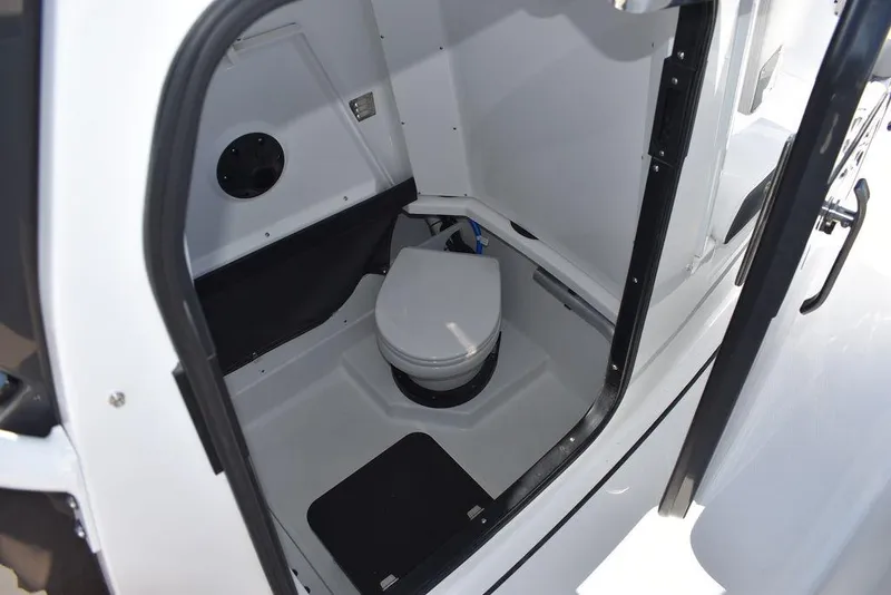 Slide: The Image of 2023 Blackfin 272CC boat interior bathroom with toilet. - 13