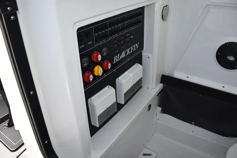 Slide: The Image of 2023 Blackfin 272CC control panel with switches and circuit breakers. - 14