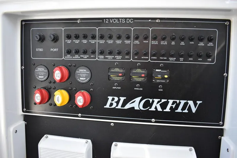 Slide: The Image of Control panel of a 2023 Blackfin 272CC boat with various switches and indicators. - 16