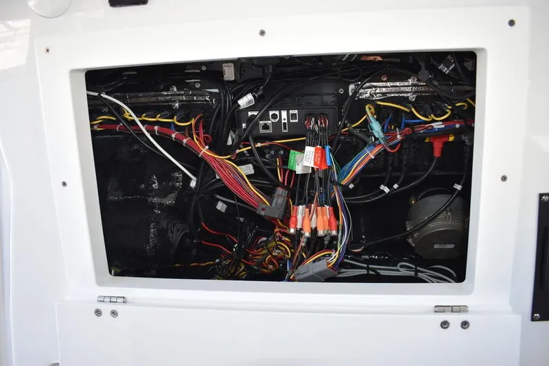 Slide: The Image of Electrical wiring compartment of a 2023 Blackfin 272CC boat. - 17