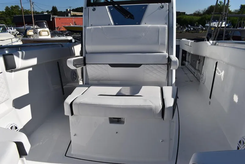 Slide: The Image of 2023 Blackfin 272CC boat interior with white seating and console. - 23