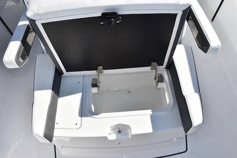 Slide: The Image of 2023 Blackfin 272CC boat seat with storage compartment open. - 24
