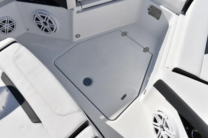 Slide: The Image of 2023 Blackfin 272CC boat interior with storage compartment and speakers. - 26