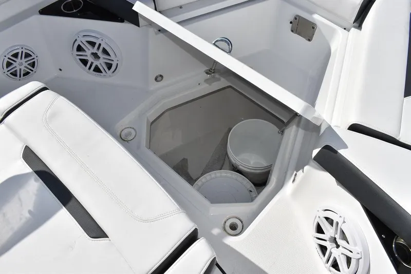 Slide: The Image of 2023 Blackfin 272CC boat storage compartment with speakers and seating. - 27