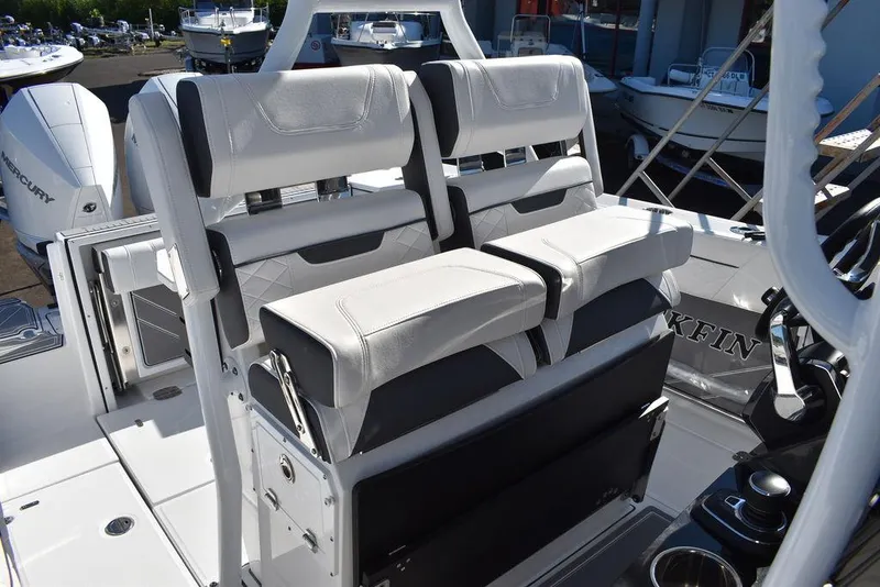 Slide: The Image of 2023 Blackfin 272CC boat interior with dual white cushioned seats. - 30