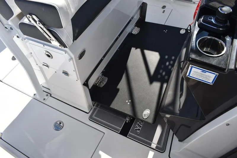 Slide: The Image of 2023 Blackfin 272CC boat interior, featuring seating and storage compartments. - 33