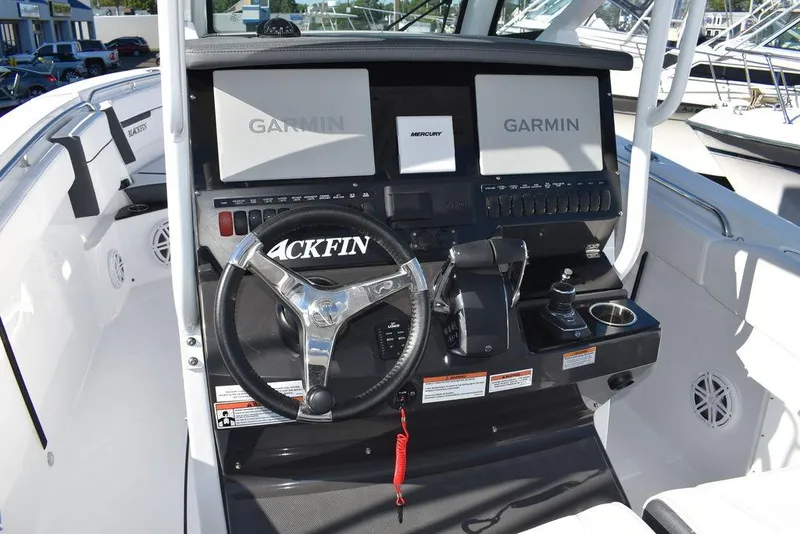 Slide: The Image of 2023 Blackfin 272CC boat dashboard with Garmin navigation system. - 34