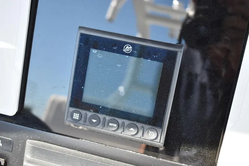 Slide: The Image of Close-up of the 2023 Blackfin 272CC boat's digital display screen. - 37