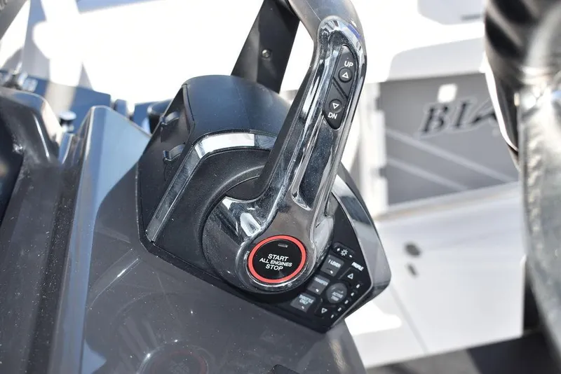 Slide: The Image of 2023 Blackfin 272CC boat throttle control with start/stop button. - 38