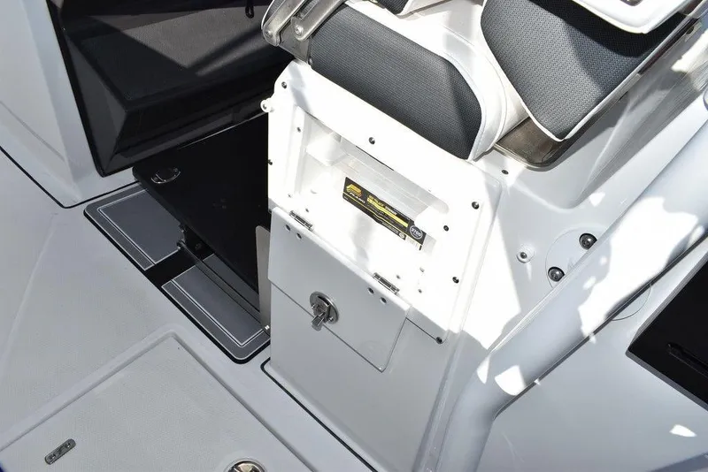 Slide: The Image of 2023 Blackfin 272CC boat interior, featuring storage compartments and seating. - 45