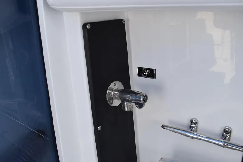 Slide: The Image of 2023 Blackfin 272CC raw water outlet and hose holder. - 46