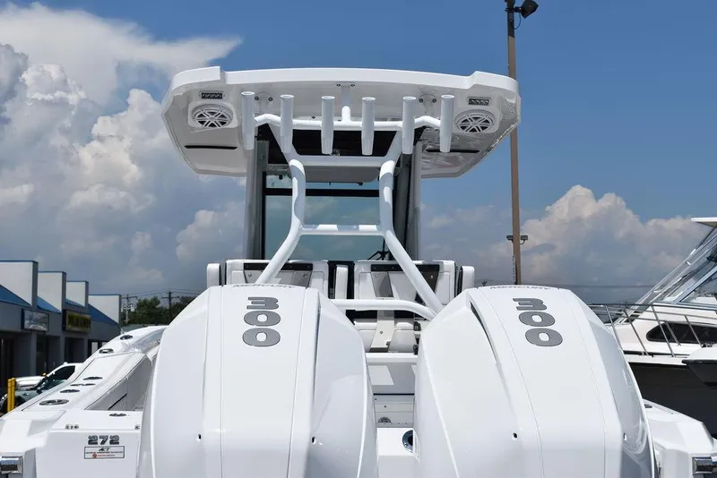 Slide: The Image of 2023 Blackfin 272CC boat with dual outboard engines, rear view. - 7