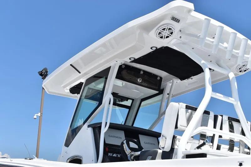 Slide: The Image of 2023 Blackfin 272CC center console boat with T-top and Garmin electronics. - 9
