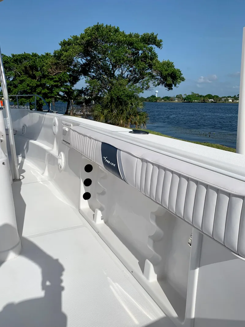 Slide: The Image of 2004 Pro-Line 25 Sport boat interior with lake view. - 12