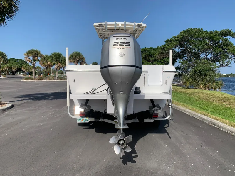 Slide: The Image of 2004 Pro-Line 25 Sport boat with Honda 225 outboard motor, rear view. - 14