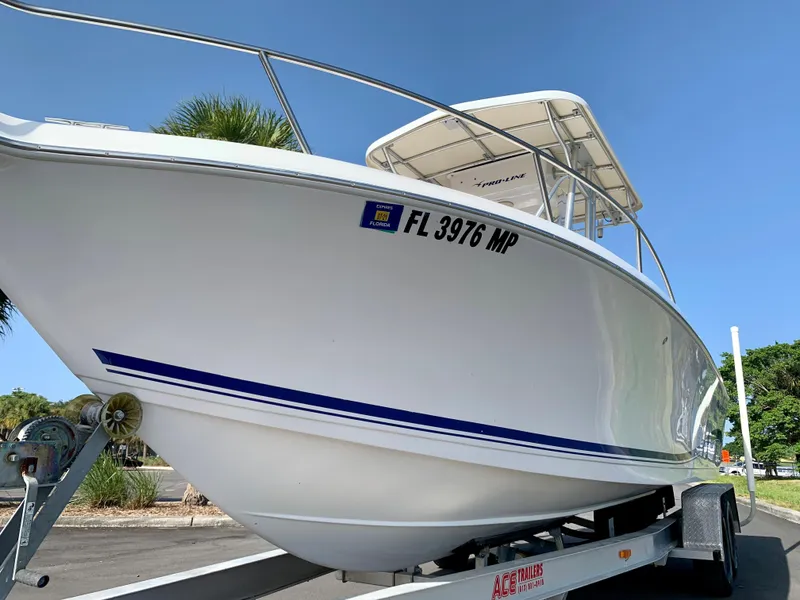 Slide: The Image of 2004 Pro-Line 25 Sport boat on trailer, side view. - 19