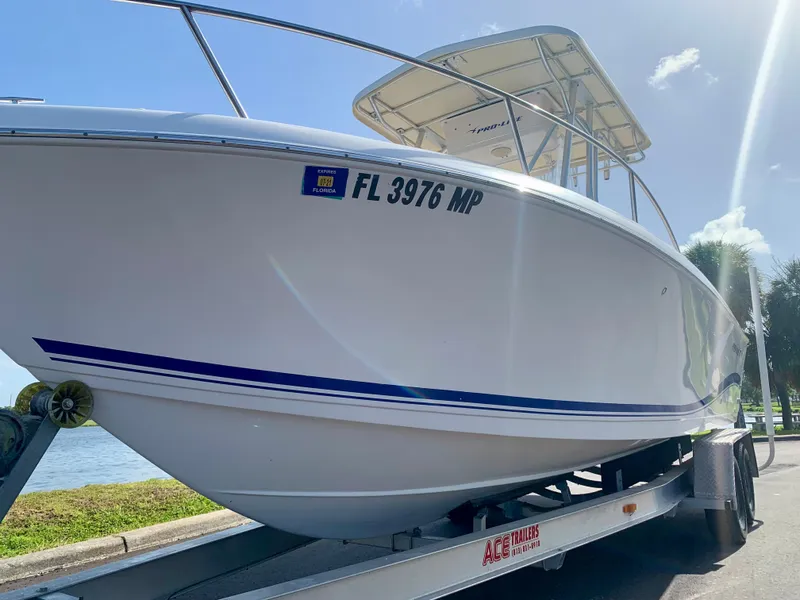 Slide: The Image of 2004 Pro-Line 25 Sport boat on trailer, side view, registration FL 3976 MP. - 5