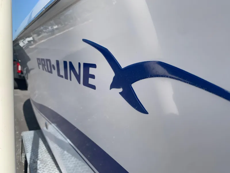 Slide: The Image of 2004 Pro-Line 25 Sport boat side view with logo. - 6