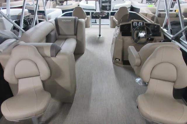 Slide: The Image of 2023 Sylvan MIRAGE 8522 Party Fish 4.0 interior with beige seating and steering console. - 13