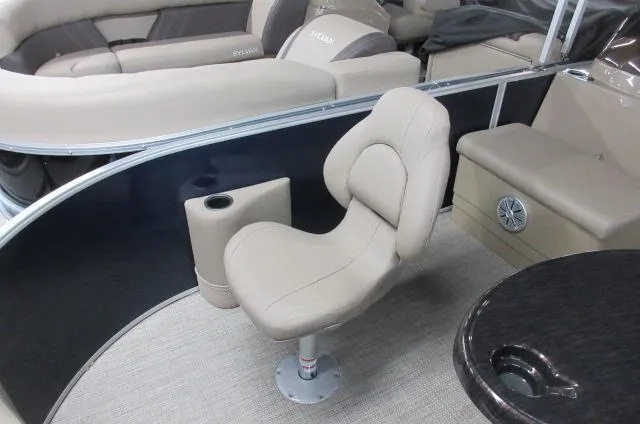 Slide: The Image of 2023 Sylvan MIRAGE 8522 Party Fish 4.0 boat interior with beige seating. - 2