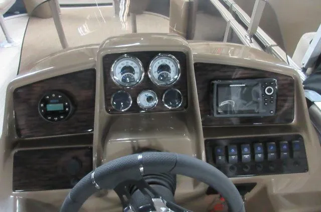 Slide: The Image of 2023 Sylvan MIRAGE 8522 Party Fish 4.0 dashboard with steering wheel and control panel. - 6