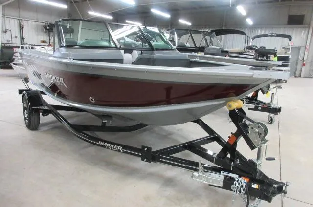 The Image of 2023 Smoker Craft Pro Angler 172 boat on a trailer in a showroom. - 0