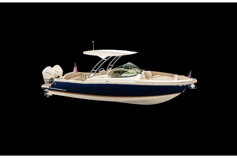 Slide: The Image of 2023 Chris-Craft Calypso 27 boat with dual outboard engines, navy blue hull. - 0