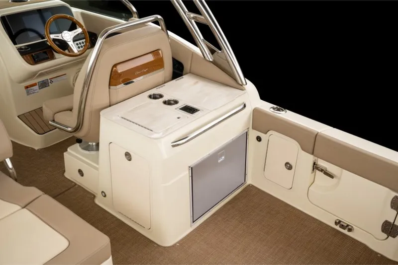Slide: The Image of 2023 Chris-Craft Calypso 27 interior, featuring helm station and seating area. - 12