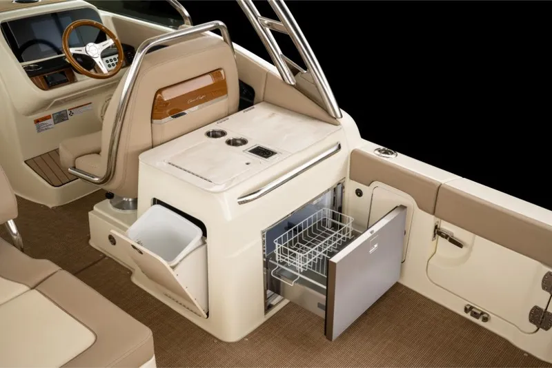 Slide: The Image of 2023 Chris-Craft Calypso 27 interior with built-in storage and appliances. - 13