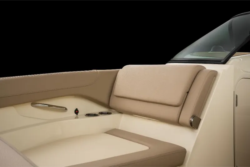 Slide: The Image of 2023 Chris-Craft Calypso 27 boat interior with beige seating and cup holders. - 14