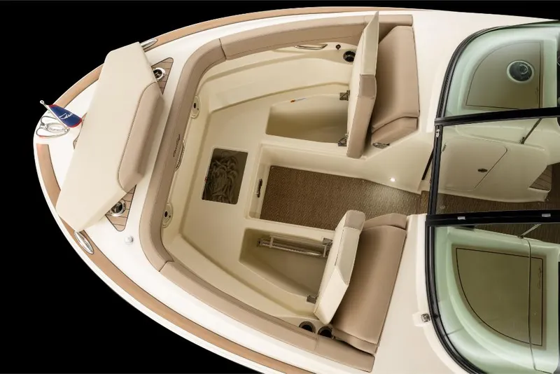 Slide: The Image of 2023 Chris-Craft Calypso 27 boat interior with beige seating and wooden flooring. - 20