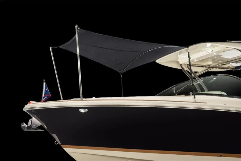 Slide: The Image of 2023 Chris-Craft Calypso 27 boat with black hull and sunshade. - 22
