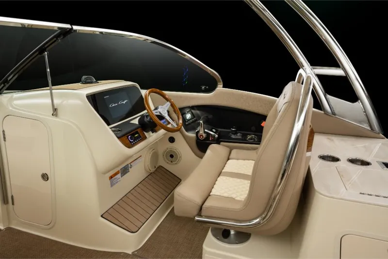 Slide: The Image of 2023 Chris-Craft Calypso 27 boat interior with helm station and seating. - 26
