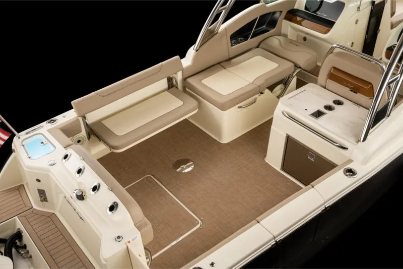 Slide: The Image of 2023 Chris-Craft Calypso 27 boat interior with beige seating and modern amenities. - 8