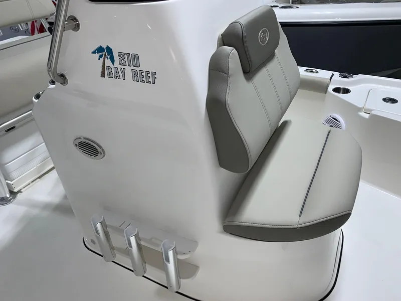 Slide: The Image of 2024 Key West 210 Bay Reef boat interior with cushioned seating. - 11