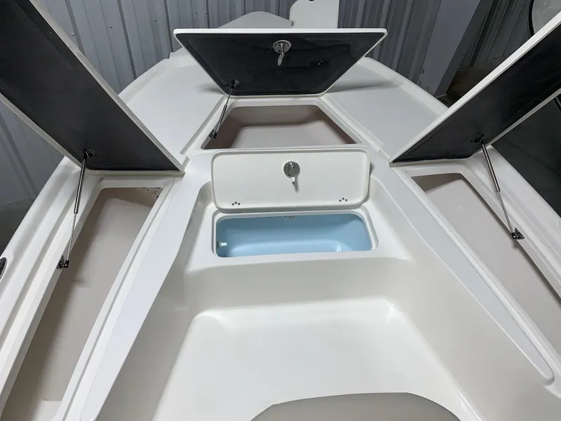 Slide: The Image of 2024 Key West 210 Bay Reef boat storage compartments and livewell. - 13