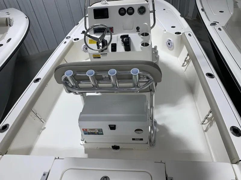 Slide: The Image of 2024 Key West 210 Bay Reef boat interior with console and seating. - 2