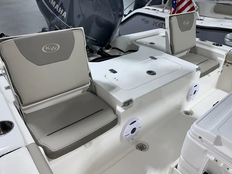 Slide: The Image of 2024 Key West 210 Bay Reef boat interior with seating and storage compartments. - 3