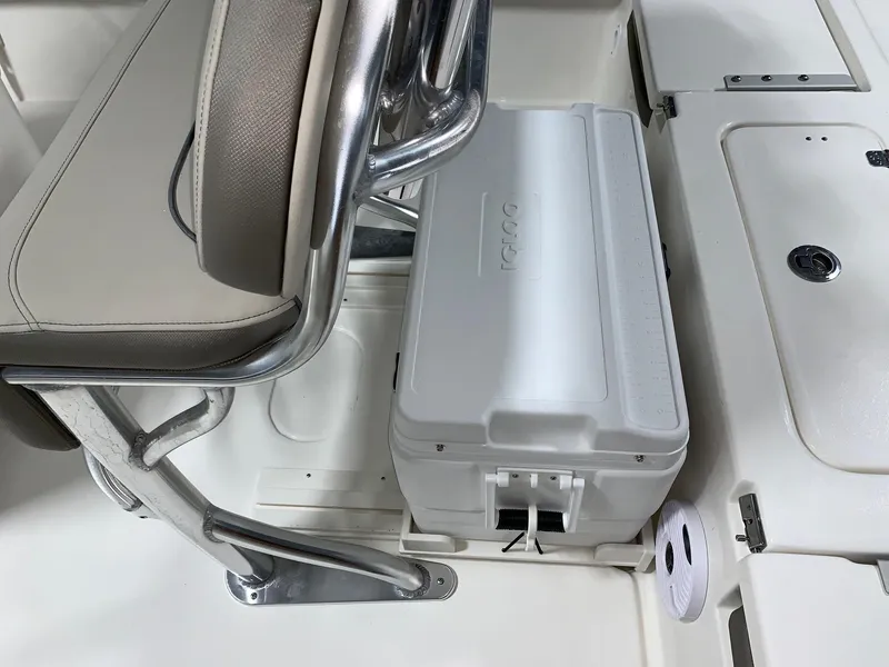 Slide: The Image of 2024 Key West 210 Bay Reef boat interior with cooler storage. - 5