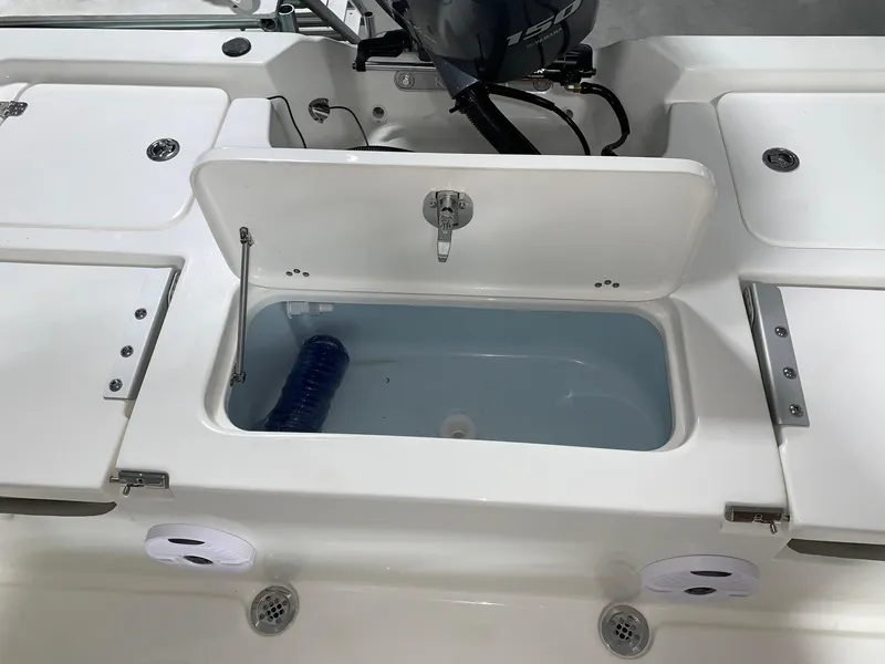 Slide: The Image of 2024 Key West 210 Bay Reef boat livewell and storage compartments. - 6