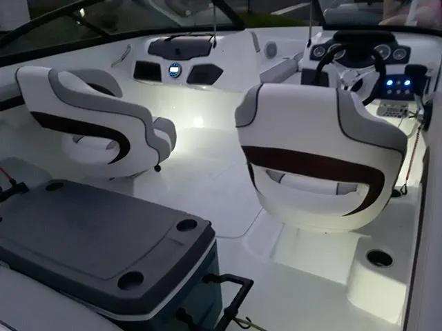 Slide: The Image of Interior of a 2020 Tahoe 700 boat with illuminated seating and control panel. - 4